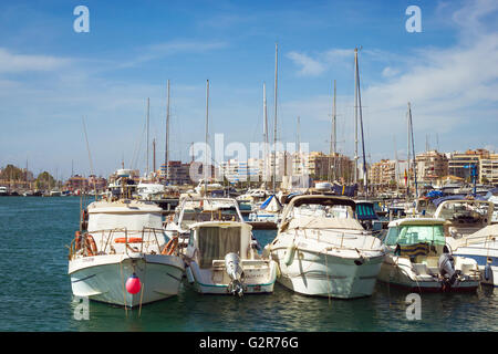 TORREVIEJA, SPAIN - SEPTEMBER 13, 2014: Puerto deportivo Marina Salinas. Yachts and boats parked at dock in Marina of Torrevieja Stock Photo