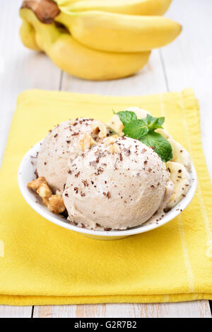 Scoops of homemade banana ice cream with nuts Stock Photo
