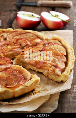 Sliced apple pie on paper, fruit baking Stock Photo