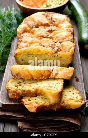 Sliced vegetable moist bread with zucchini, carrot, cheese, eggs Stock Photo