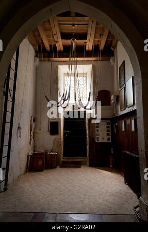 Bell ropes at the bottom of the bell tower in St Mary's Church, Selborne, Selborne, Hampshire, United Kingdom Stock Photo