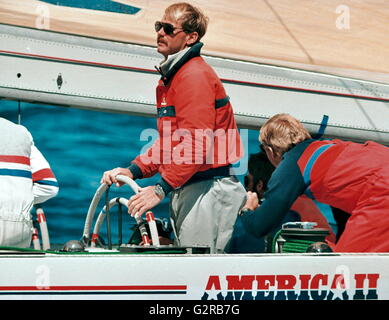 AJAXNETPHOTO. 8TH OCT 1986. FREMANTLE, WESTERN AUSTRALIA - AMERICA'S CUP - JOHN KOLIUS, SKIPPER, AT THE WHEEL OF AMERICA II. PHOTO:AJAXNETPHOTO.COM REF:AMCUP86 81403 25 4 Stock Photo