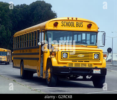 A bright yellow American school bus. Stock Photo