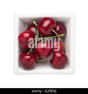 Cherries in a square bowl isolated on white background Stock Photo