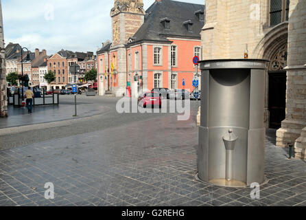 A permanent (pop-up) public urinal (this one by UriLift) in Sint Truiden, Limburg, Belgium (with a bottle of beer on top). Stock Photo