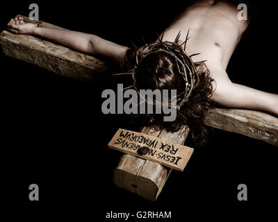 Close-up arm when lying dead Christ on the cross Stock Photo