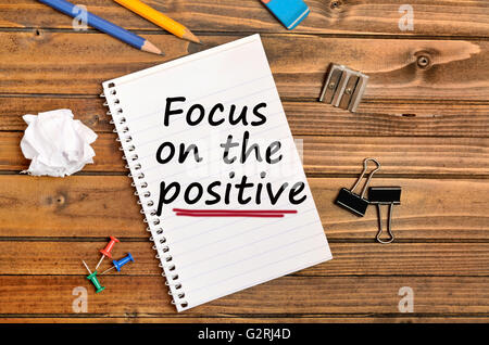 Words Focus on the positive on notebook Stock Photo