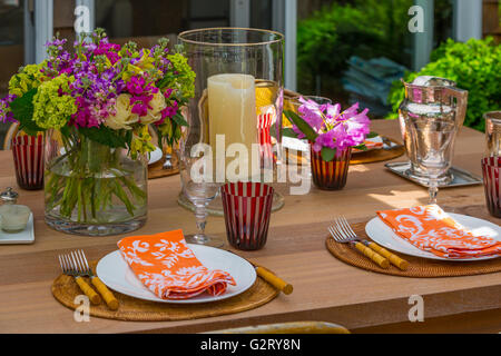 table top setting with fresh flowers outside Stock Photo