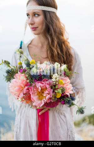 girl with a wedding bouquet boho style Stock Photo