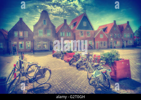 Vintage Dutch town of Volendam European evening. Retro style. houses and bikes on the street in the summer Stock Photo