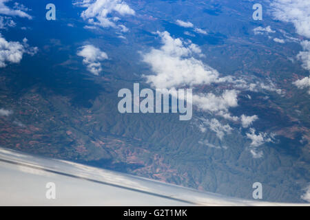 Cloudy sky view from airplane cabin window, stock photo Stock Photo