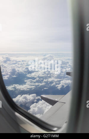 Cloudy sky view from airplane cabin window, stock photo Stock Photo