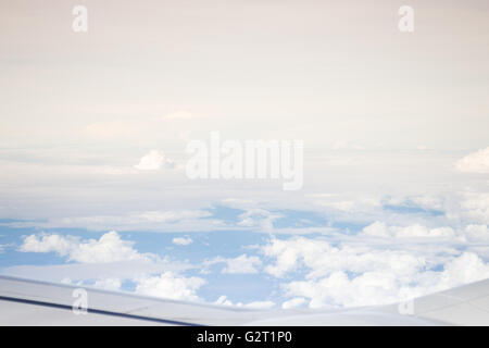 Cloudy sky view from airplane cabin window, stock photo Stock Photo