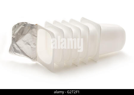 Empty plastic yogurt pots on white backround Stock Photo