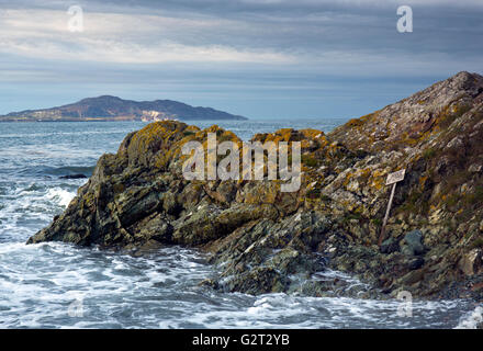 Porth Tyddyn with views from beach to Holy Island near Church Bay on the northern western coast on Isle of Anglesey North Wales Stock Photo