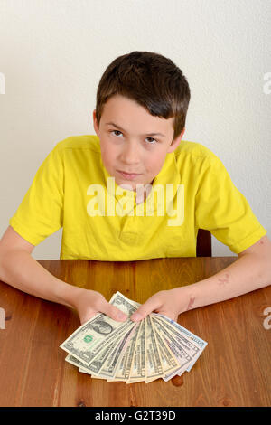 Child showing proudly his money Stock Photo