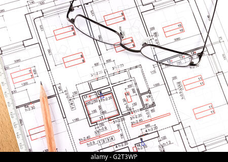 Eyeglasses and architectural drawings tools on construction blueprint Stock Photo