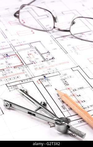 Eyeglasses and architectural drawings tools on construction blueprint Stock Photo