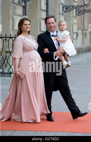 Princess Madeleine of Sweden, Christopher O'Neill, and Princess Leonore, attend Prince Carl Philip of Sweden's Wedding Stock Photo