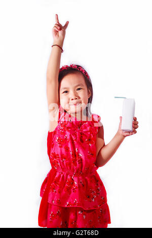Happy kid Girl drinking milk or yogurt Stock Photo