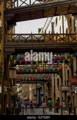 Overhead goods gantries linking old warehouses at Shad Thames now converted into luxury apartments and Shops, Shad Thames, Southwark, London ,UK Stock Photo