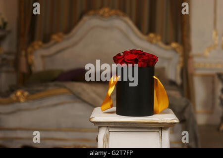 Red roses in black box Stock Photo