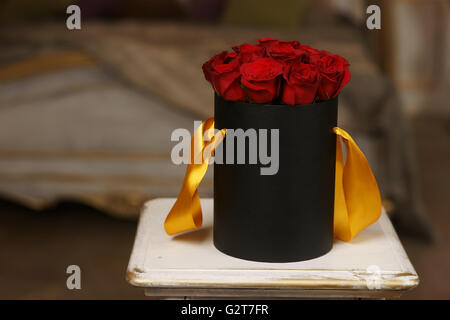 Red roses in black box Stock Photo