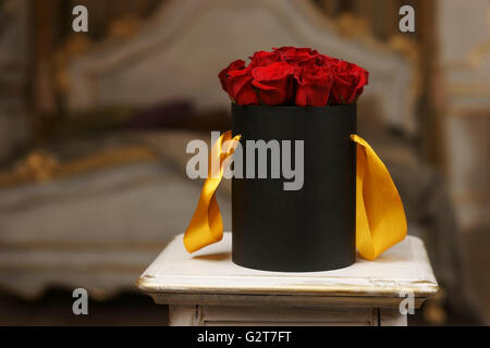 Red roses in black box Stock Photo