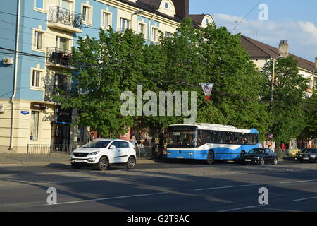 Urban bus service in Kaliningrad city. Most operated vehicles are second-hand. Old blue bus en route in city center Stock Photo