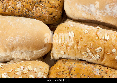 Close up shot of various types of bread finger rolls laying on a plate Stock Photo