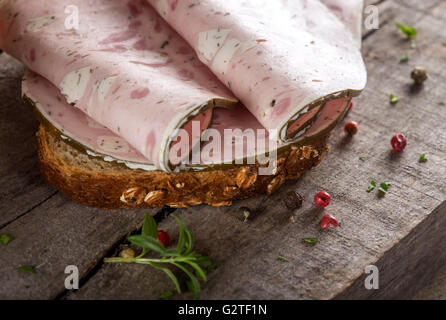 Specialty meat sandwich made with sheep cheese and vine leaves Stock Photo