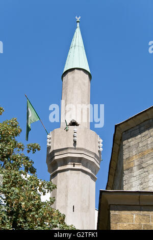 Minaret of mosque in Belgrade over blue sky Stock Photo