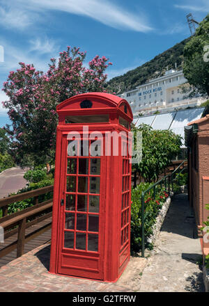 View from the Alameda botanic gardens, Gibraltar, towards a red phone box and The Rock Hotel Stock Photo