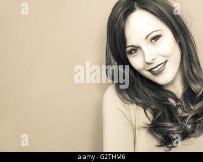 Creative Toned Portrait of an Attractive Young Woman Looking at the Camera Happy Pleased Smiling and Successful Stock Photo