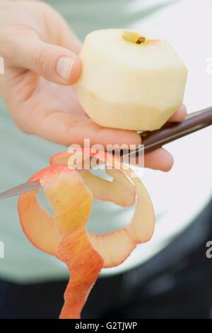 Peeled apple and apple peel Stock Photo