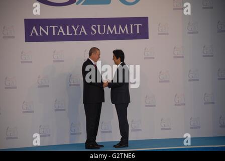 Japan's Prime Minister Shinzo Abe (R) is greeted by Turkish President Recep Tayyip Erdogan, during the G20 Turkey Leaders Summit