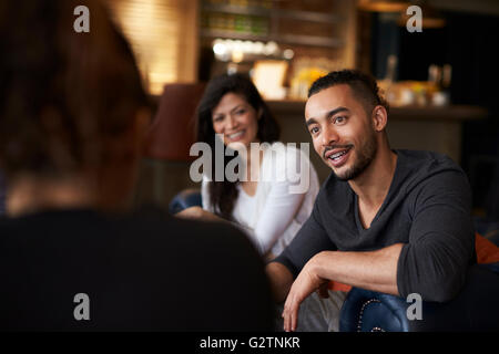 Group Of Friends Meeting For Coffee In Bar Stock Photo