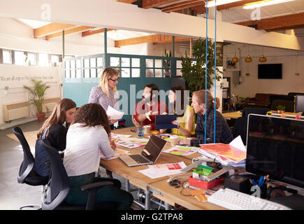 Wide Angle Shot Of Female Manager At Brainstorming Meeting Stock Photo