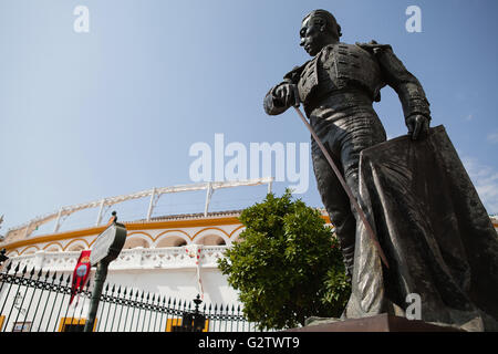 Spain, Andalucia, Seville, Statue  of the matador Curro Romero outside the Plaza de Torres. Stock Photo