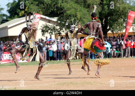 Traditional dancers entertain guests in Uganda. Music and dance are very crucial elements of African society Stock Photo