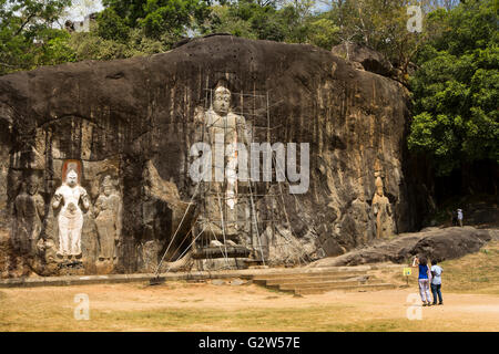 Sri Lanka, Buduruwagala, Buddhist temple complex, scaffolding round huge 16metre tall buddha Stock Photo