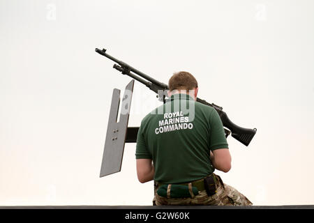 Armed British Royal Marines Commando with a heavy calibre weapon at the International Mersey River Festival 2016, Stock Photo