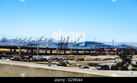 The Port of Oakland, The Bay Bridge, and San Francisco seen from Interstate 880 in Oakland California Stock Photo