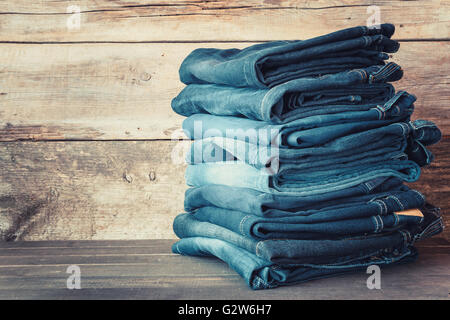 Stacked fashion blue jeans in store Stock Photo