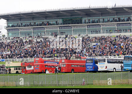 Epsom Downs, Surrey, England, UK. 3rd June 2016. Ladies Day at Epsom Downs race course. The traditional open top buses in front of the grandstand where race goers come to see the best flat racing in the world. Credit:  Julia Gavin UK/Alamy Live News Stock Photo