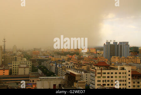 Zhangye, China's Gansu Province. 3rd June, 2016. Buildings are shrouded in sand and dust in Zhangye City, northwest China's Gansu Province, June 3, 2016. A sandstorm hit the city on Friday afternoon. Credit:  Chen Li/Xinhua/Alamy Live News Stock Photo