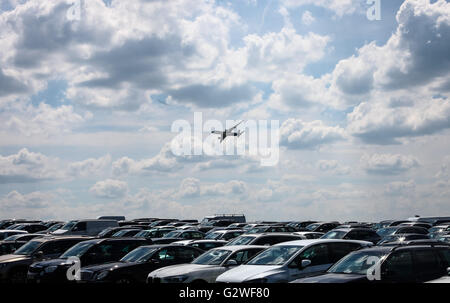 Berlin, Germany. 3rd June, 2016. Airbus A-350 airliner flies over a parking area as it performs during the 2016 ILA Berlin Air Show in Berlin, Germany, on June 3, 2016. The 4-day ILA exhibition kicked off on Wednesday with the participation of 1,017 exhibitors from 37 countries and regions. Credit:  Zhang Fan/Xinhua/Alamy Live News