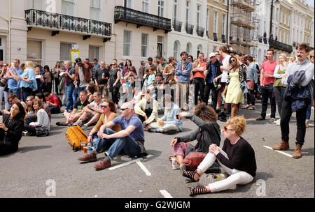 Brighton UK 4th June 2016 - Thousands of people flock to the Kemptown Carnival in Brighton which is one of the largest community events in the city with live bands and dancers performing on 6 stages throughout the afternoon Credit:  Simon Dack/Alamy Live News Stock Photo