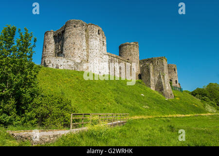 Kidwelly, in Welsh, Cydweli Castle in Kidwelly, Carmarthenshire south Wales on sunny, blue sky Spring day showing wooden bridge Stock Photo