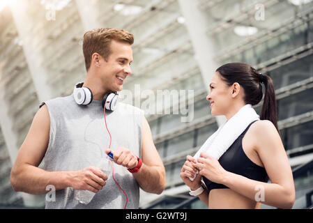 Guy and woman working out in city Stock Photo